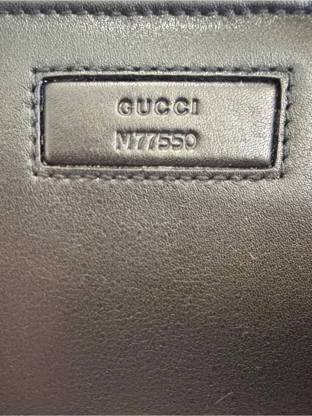 Gucci Black Leather Wallet with Embossed Logo